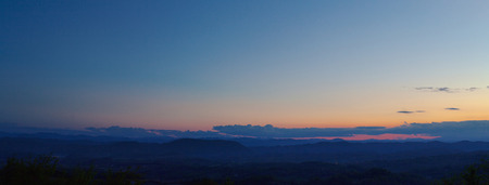 Sunset in Serbian village, wide fields and meadows of Dragacevo, central Serbia.の写真素材