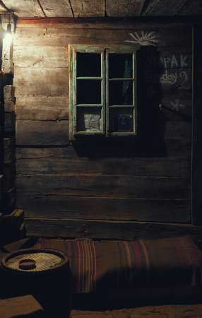 Details of an old wooden house, window and wall closeup. の写真素材