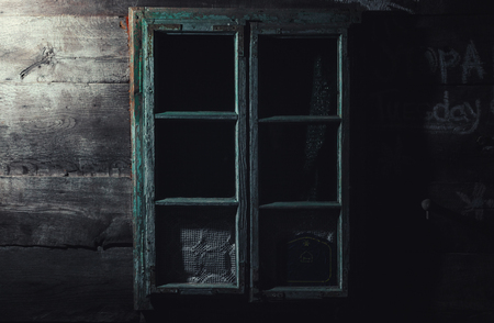 Details of an old wooden house, window and wall closeup.の写真素材