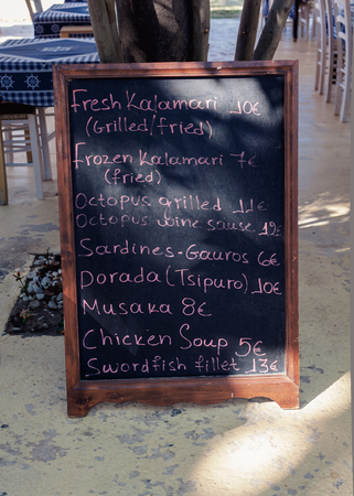 Menu articles of a restaurant in Greece, summer season. Grilled fish, seafood and Greek traditional cuisine.の写真素材