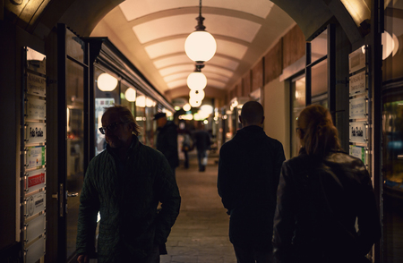 Graz, Austria - November 10, 2017: One passage in old buildings in the center of the town, full of fashion stores.のeditorial素材