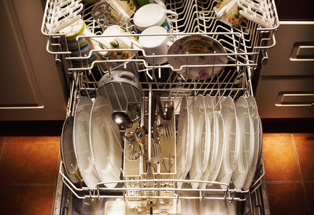 Clean dishes and accessories in dishwasher after washing.の写真素材
