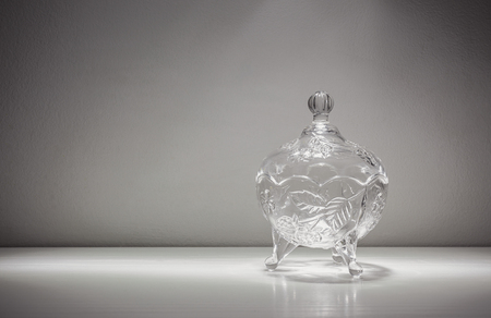 Little glass bowl for candies, empty on table. の写真素材