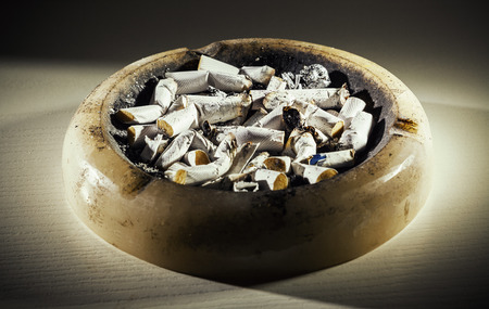 Closeup view of marble ashtray full of butts.の写真素材