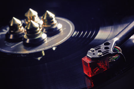 Details of modern gramophone in work, dark ambient, accentuated shapes with illumination.の写真素材