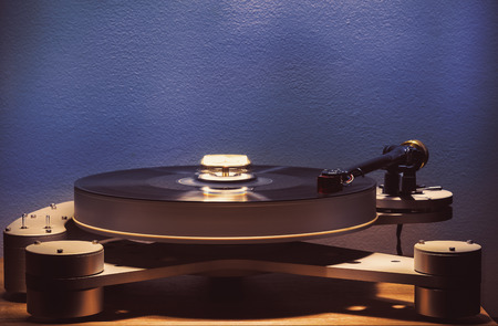 Details of modern gramophone in work, dark ambient, accentuated shapes with illumination.の写真素材