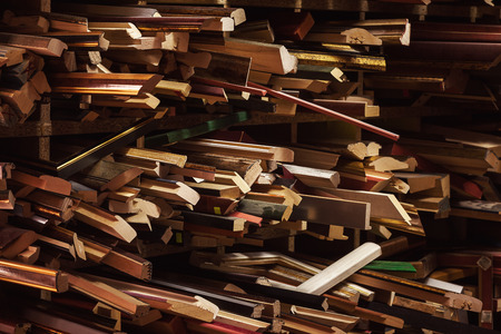 Abstract composition of various wooden decorative frames for pictures in workshop. の写真素材