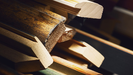 Abstract composition of various wooden decorative frames for pictures in workshop. の写真素材