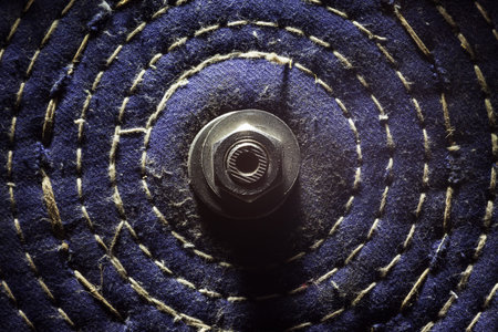 Tool for sharpening small blades, made of cloth with metal screw in the center. 