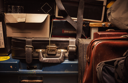Details of a lot of old and dusty suitcases and boxes. の写真素材