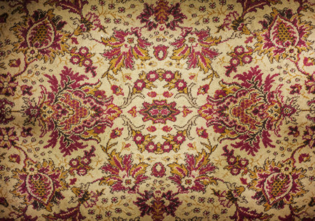 Texture of an old colorful decorative carpet. 