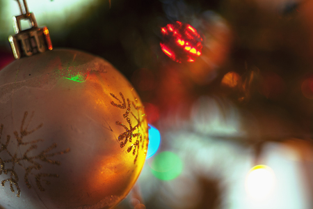 Closeup view of colorful parts of Christmas tree with ornaments and lights. の写真素材