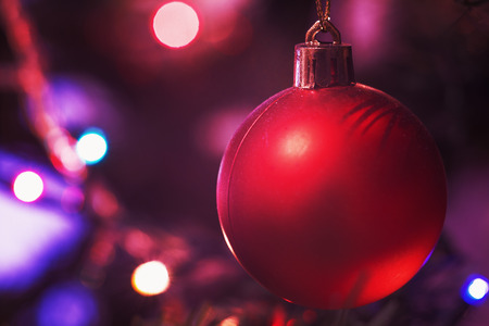 Closeup view of colorful parts of Christmas tree with ornaments and lights. の写真素材