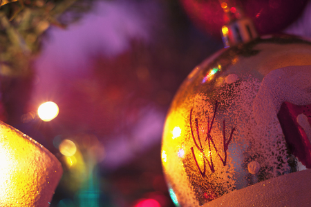 Closeup view of colorful parts of Christmas tree with ornaments and lights. の写真素材
