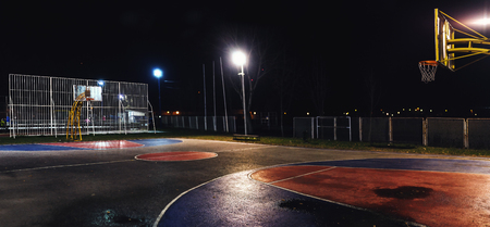 Street basketball yard by night, outdoor scene.の写真素材