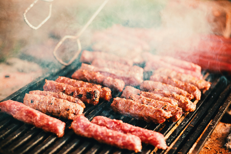 Barbecues and sausages on the grill, details from the picnic.の写真素材