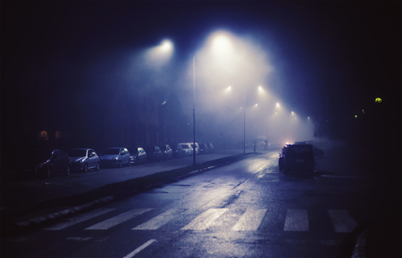 Night scene from small Balkan town, foggy atmosphere.  の写真素材