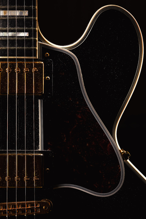 Details of an old dusty electric guitar.の写真素材