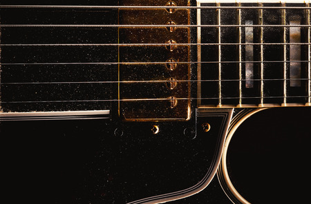 Details of an old dusty electric guitar.の写真素材