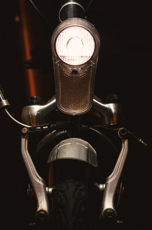 Closeup details of modern bicycle, accentuated shapes with light.の写真素材