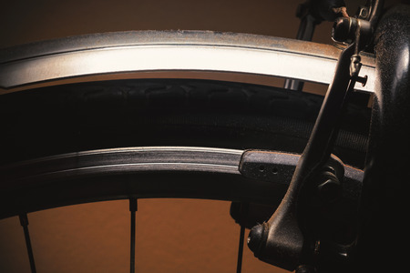 Closeup details of modern bicycle, accentuated shapes with light.の写真素材
