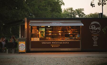 Cacak, Serbia - July 17, 2018: Bakery small shops in city park besides the river Morava, summer season.のeditorial素材