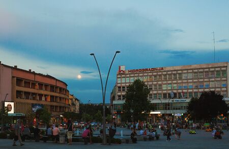 Cacak, Serbia - July 26, 2018: Downtown details during evening, summer season, main public square architecture structure.のeditorial素材