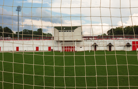 Empty football yard, details of goal and field during day.の写真素材