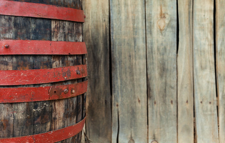 Village lifestyle, part of an old wooden barrel, closeup view.の写真素材