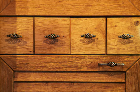 Small wooden drawers, part of wooden furniture in kitchen.の写真素材