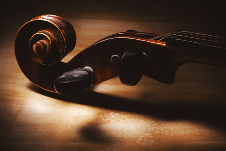 Closeup view on old dusty violin, details of wood and structure.の写真素材
