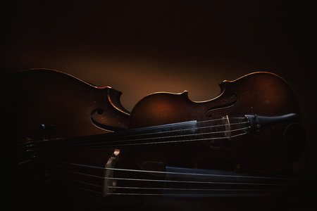 Details of old violin and cello, accentuated shapes and textures.の写真素材