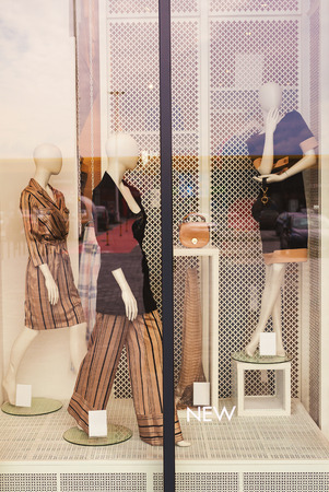 Modern fashion shop, store window closeup during day.の写真素材