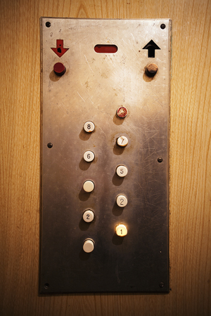 Details of an old elevator, close-up view on elevator buttons.の写真素材
