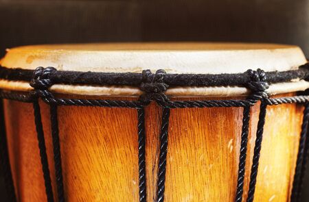 Black ropes of a wooden djembe, closeup view.の写真素材