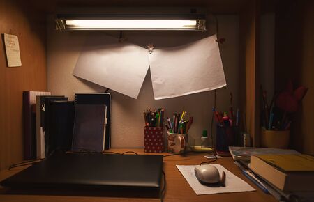 Home interior details, working table during night, scene from ordinary life.の写真素材