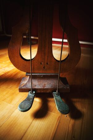 Details of an old piano, dusty and rusty foot pedals closeup.の写真素材