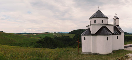 Exterior of a small and new Orthodox church in Serbia, summer season.