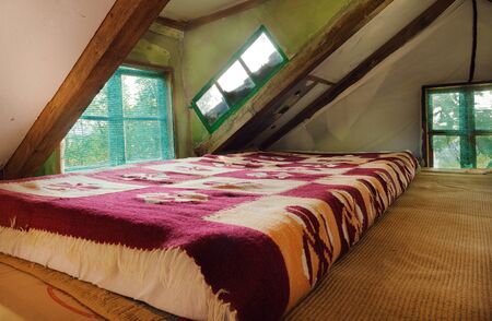 Old wooden house interior. Part of a traditional household from Serbia, details of furniture.の写真素材