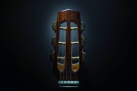 Details of an old and dusty gypsy jazz acoustic guitar, Django style, closeup view of head and tuners.の写真素材