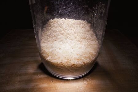Fresh rice in a glass bottle, closeup view.の写真素材