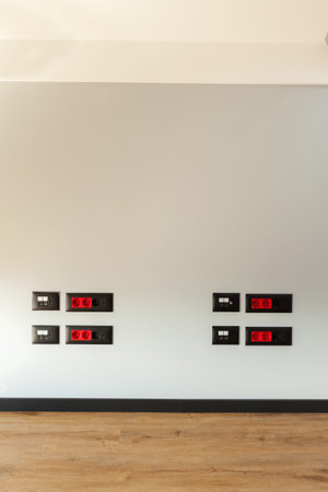 Details of a new and empty room, current and net plugs in the wall.