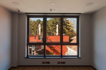New and empty office interior, entrance wall of glass, during day.の写真素材
