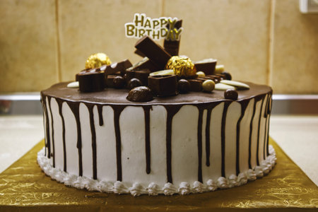 Details of beautifully decorated birthday cake.