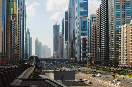 Dubai, United Arab Emirates - January 21, 2022: View on Dubai's buildings and traffic from one metro station during day.のeditorial素材