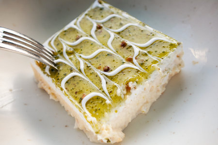 Portion of Iran's restaurant cake served on white plate.
