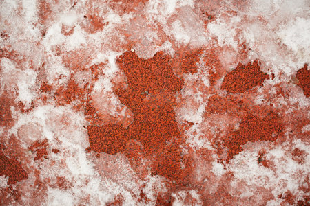 Texture details of athletic track with ice on it.
