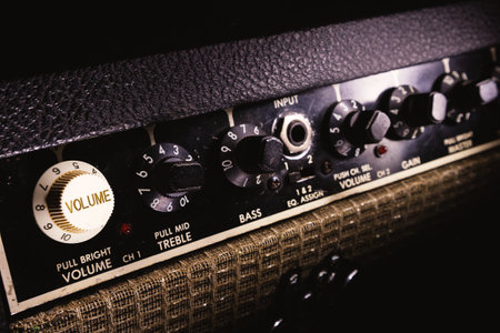 Details of a guitar amplifier, closeup view on preamp and pots.の写真素材
