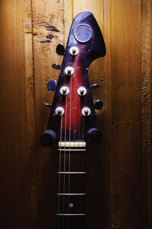 Details of an old electric guitar, used and dusty.の写真素材