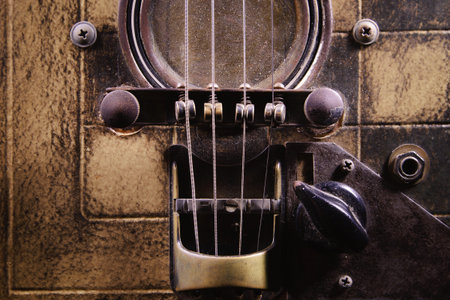 Details of a handmade cigar box guitar.